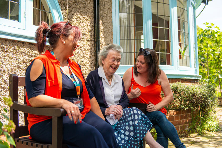 An elderly person receiving compassionate live-in care from care experts.