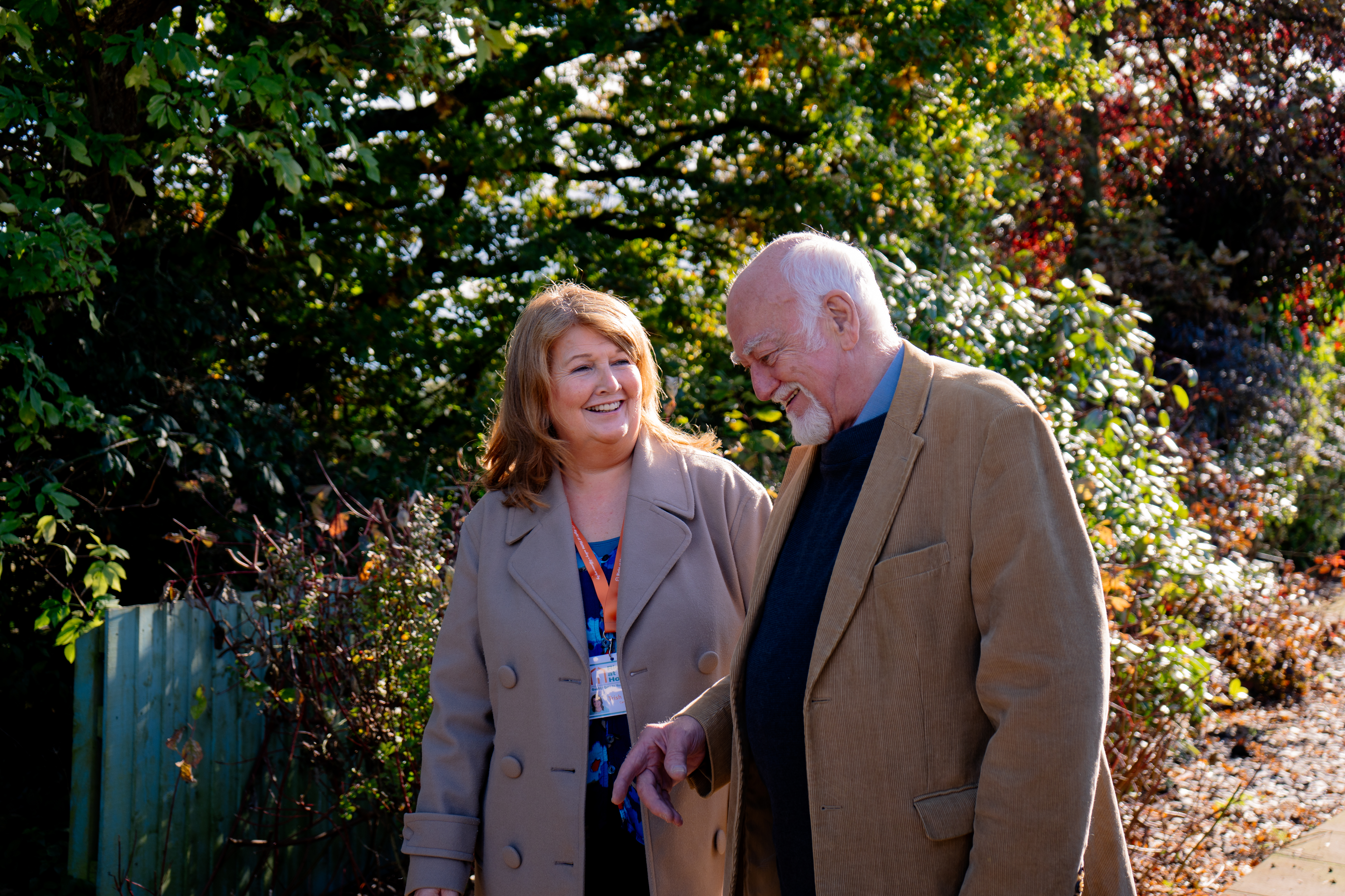 caregiver and client laughing on walk