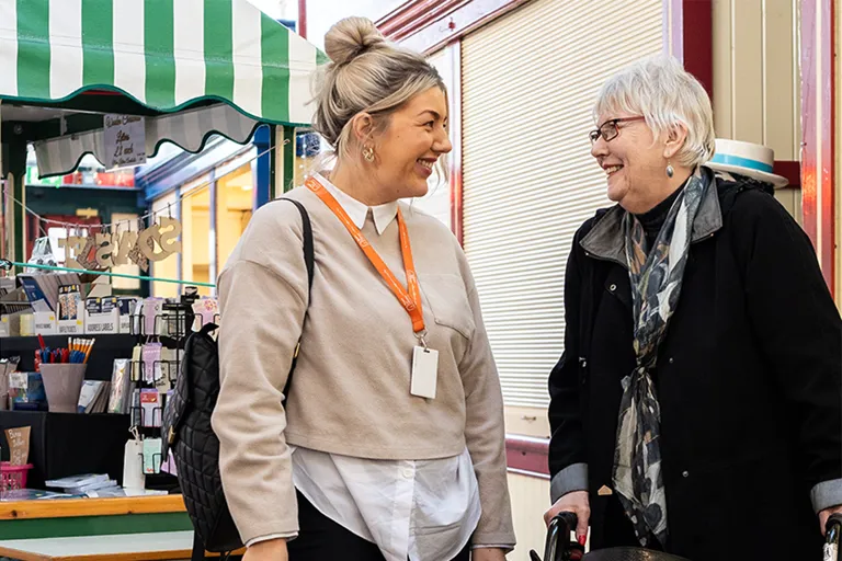 Client and Carer at market